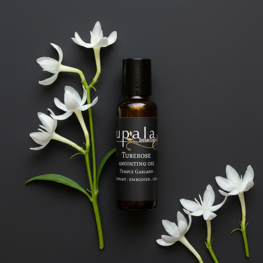 Tuberose Anointing Oil - flush cap bottle with scattered right side blossoms
